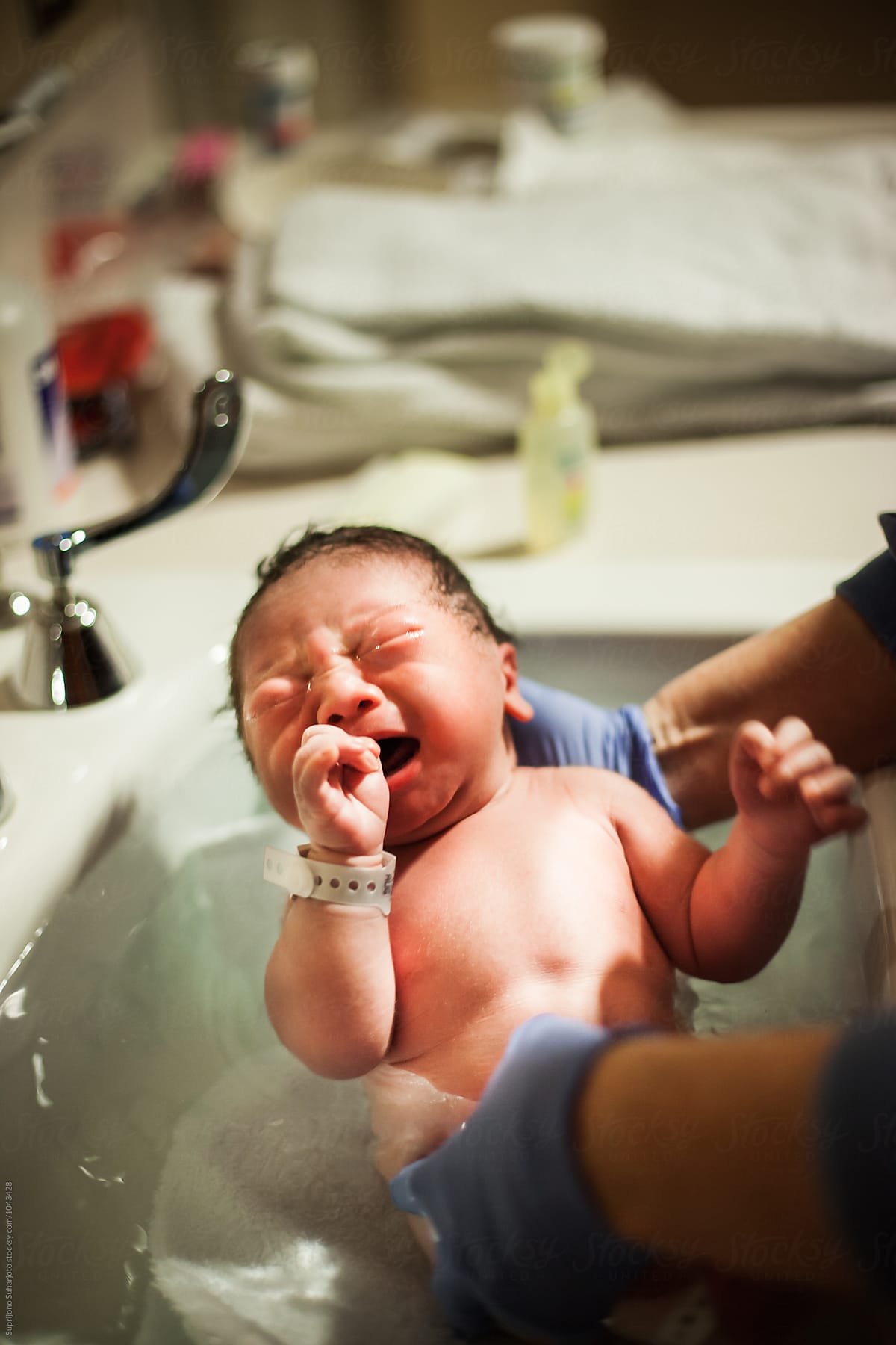 Asian Newborn Baby Taking A Bath For The First Time At The ...