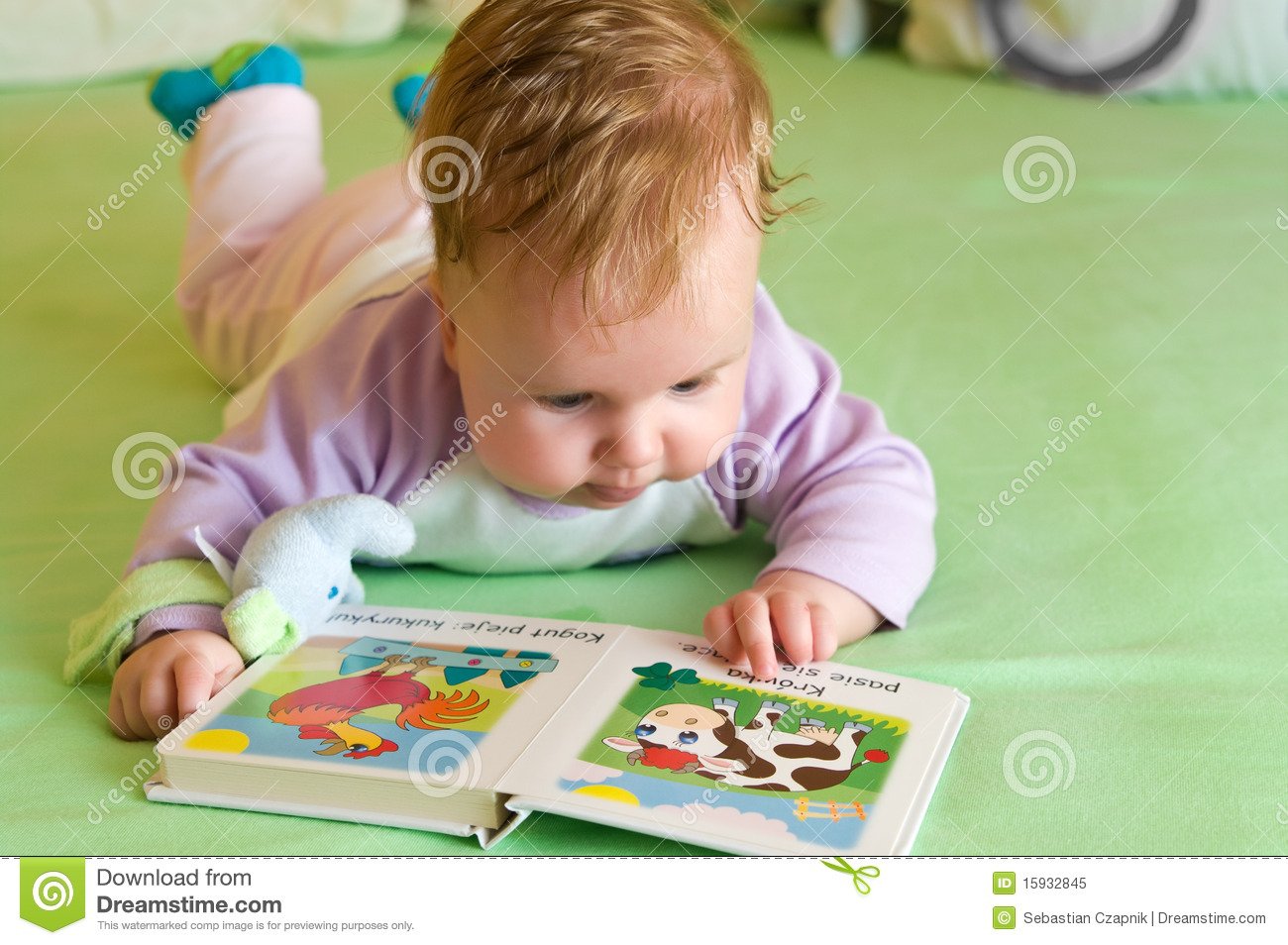 Baby Girl Reading Book Royalty Free Stock Photo