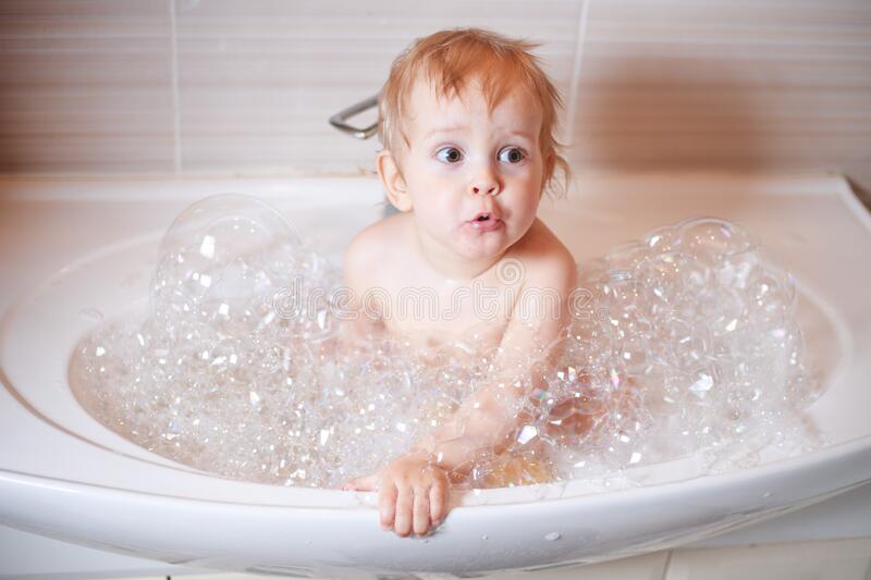 Happy Laughing Infant Baby Toddler Taking A Bath Playing ...