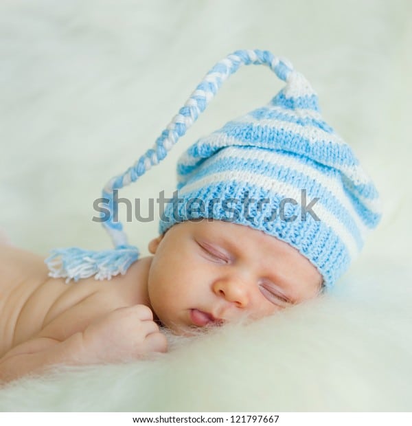 Newborn Baby Wearing White Hat Sleeping Stock Photo (Edit Now) 121797667